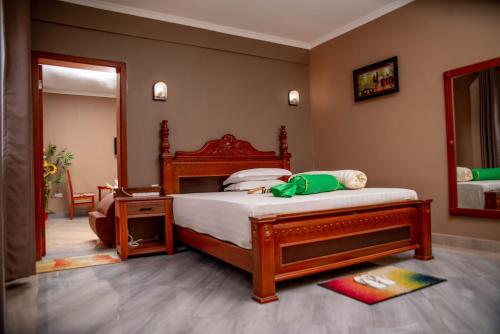 
A bed or beds in a room at Lush Garden Hotel
