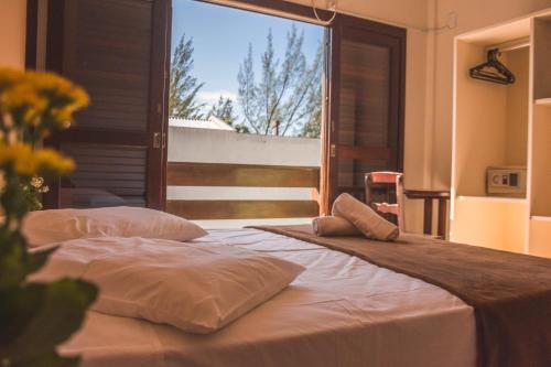 Postel nebo postele na pokoji v ubytování Hotel Pousada Capão