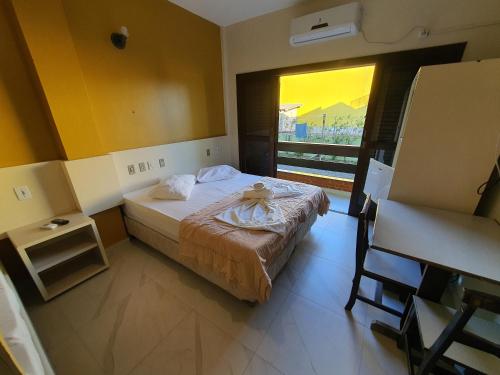 Postel nebo postele na pokoji v ubytování Hotel Pousada Capão