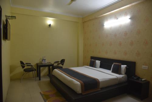 Ένα ή περισσότερα κρεβάτια σε δωμάτιο στο Hotel Nexus l Hotels In Charbagh Lucknow