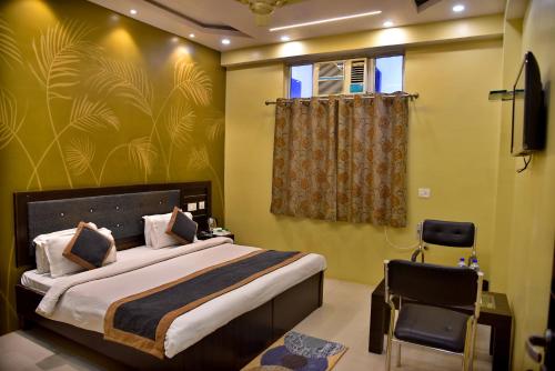 Ένα ή περισσότερα κρεβάτια σε δωμάτιο στο Hotel Nexus l Hotels In Charbagh Lucknow