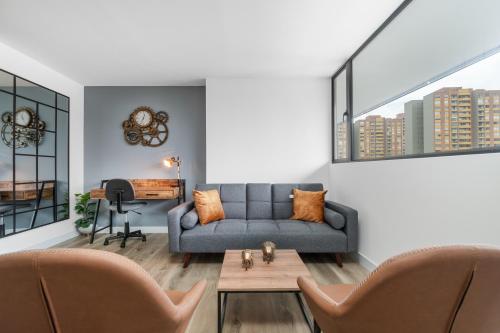 Ein Sitzbereich in der Unterkunft Apartamentos Go Living & Suites by HOUSY HOST