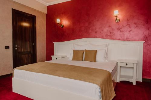 Ένα ή περισσότερα κρεβάτια σε δωμάτιο στο Boutique Hotel Cattaleya