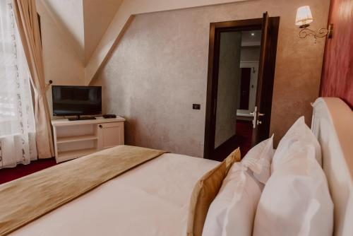Ένα ή περισσότερα κρεβάτια σε δωμάτιο στο Boutique Hotel Cattaleya
