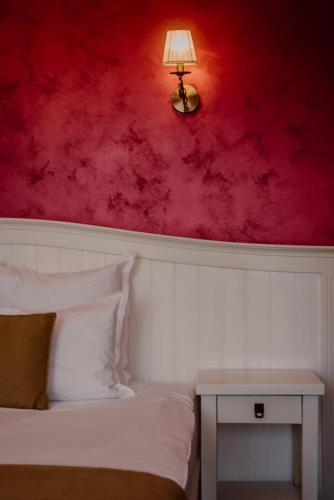Ένα ή περισσότερα κρεβάτια σε δωμάτιο στο Boutique Hotel Cattaleya