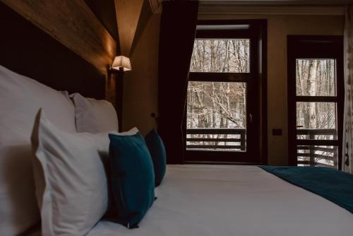Ένα ή περισσότερα κρεβάτια σε δωμάτιο στο Boutique Hotel Cattaleya