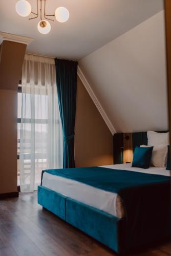 Ένα ή περισσότερα κρεβάτια σε δωμάτιο στο Boutique Hotel Cattaleya