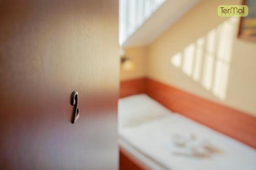 a room with a door with a sink in it at Penzion Termal in Bojnice