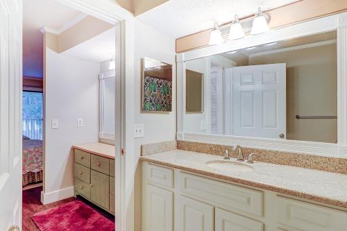 a bathroom with a sink and a mirror at Beckenham in Hilton Head Island