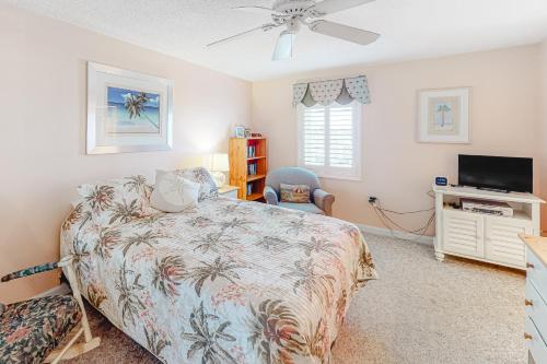 a bedroom with a bed and a flat screen tv at Sand Dollar I 301 in Ocean City