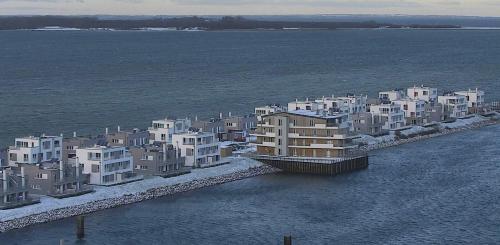 an aerial view of a city in the water at Schleivilla Hafenmeister in Kappeln
