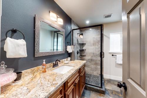 a bathroom with a sink and a shower at Meadows Crossings* in Tahoe Valley