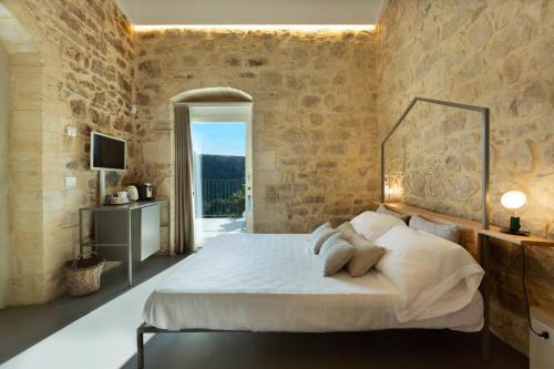 Postel nebo postele na pokoji v ubytování Innesti B&B