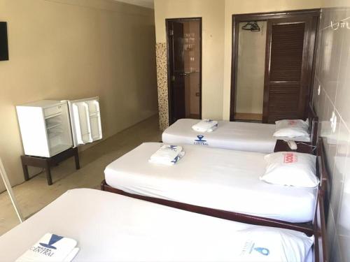Ein Bett oder Betten in einem Zimmer der Unterkunft Hotel BELCENTRO