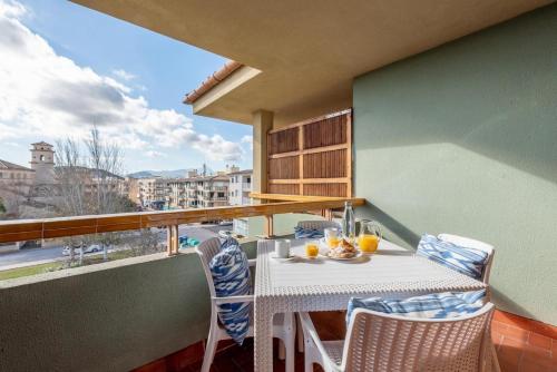 a table and chairs on a balcony with a view at BRESSOL DELUXE Apartments in Port de Pollensa