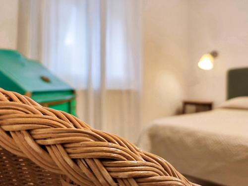 Postel nebo postele na pokoji v ubytování Hotel Sette Archi