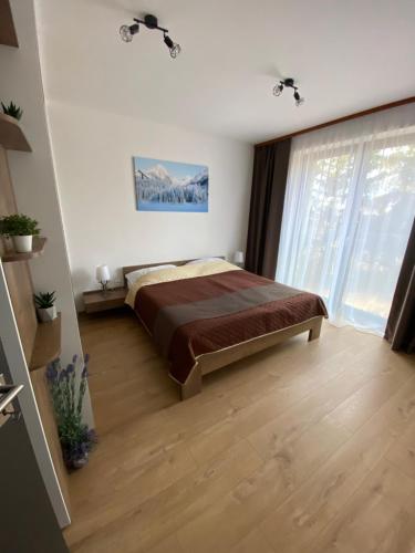 Postel nebo postele na pokoji v ubytování Apartment Tatry mountain
