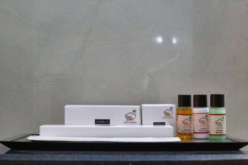 a shelf with three products on top of it at Chitwan Midtown Hotel in Bharatpur