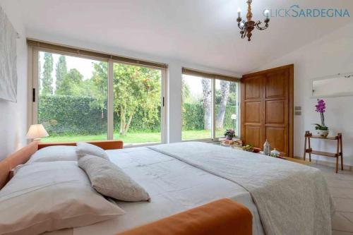 Ένα ή περισσότερα κρεβάτια σε δωμάτιο στο Alghero Villa Galatea con giardino per 8 persone vicino alla spiaggia con 4 camere