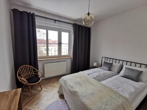 Posteľ alebo postele v izbe v ubytovaní Apartament Black&White