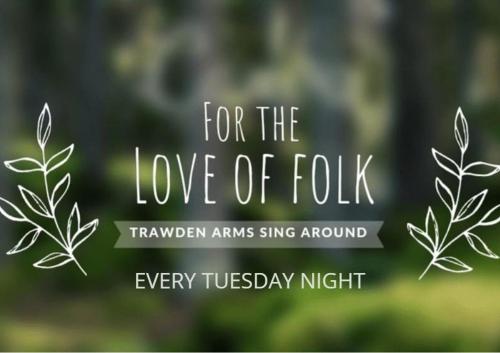 a sign that says for the love of folk at Trawden Arms Community Owned Pub in Winewall
