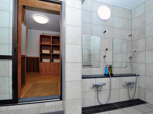 a bathroom with a shower with a glass door at Ryokan Seifuso - Vacation STAY 02206v in Matsumoto