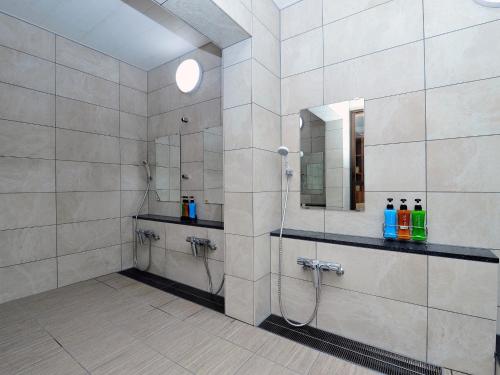 a bathroom with a shower and a mirror at Ryokan Seifuso - Vacation STAY 02206v in Matsumoto