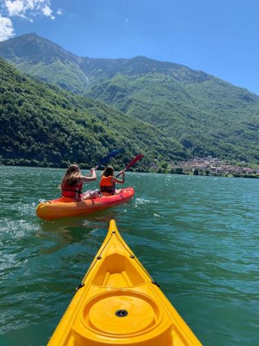 two people in a kayak on a body of water at Casa Cinzia in Gravedona