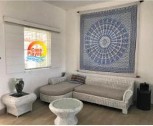 a living room with a couch and a table at Casa Playas # 1 in Playas