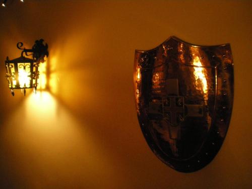 a mirror hanging on a wall next to a light at String Of Horses in Carlisle