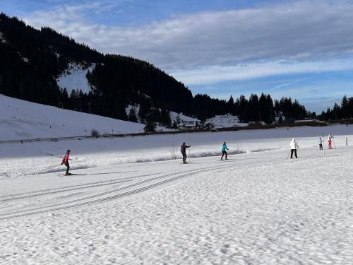 a group of people skiing in the snow at Ferienhaus Gertrud in Nesselwängle