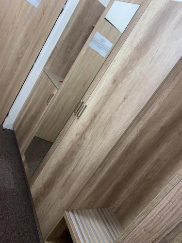 a close up of a wooden door with stairs at LC - Hotel Ostrava in Ostrava