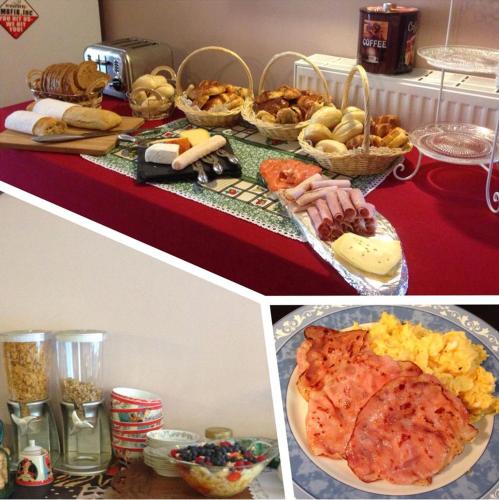 a table topped with plates of food and baskets of food at B&B AntiQua & Qook in Tongeren