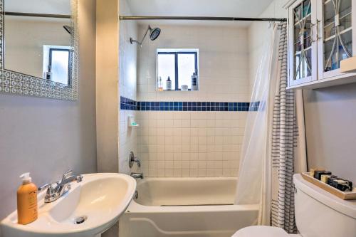 a bathroom with a sink and a tub and a toilet at 1/2 Mi to Tennyson: Pet-Friendly Denver Gem in Denver