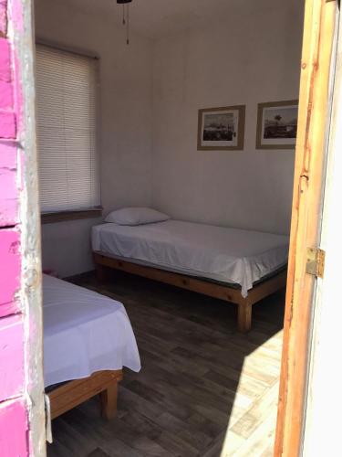 Un ou plusieurs lits dans un hébergement de l'établissement Susu’Z Village Hostel and Rooms
