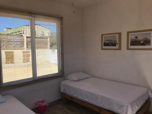 Un ou plusieurs lits dans un hébergement de l'établissement Susu’Z Village Hostel and Rooms