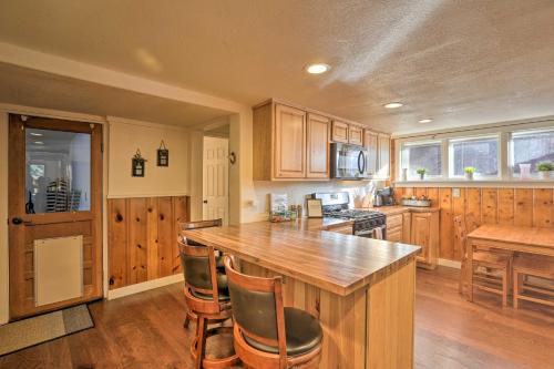 a kitchen with wooden cabinets and a wooden counter top at Wildmanor Ranch Near Red Rocks with Hot Tub! in Morrison