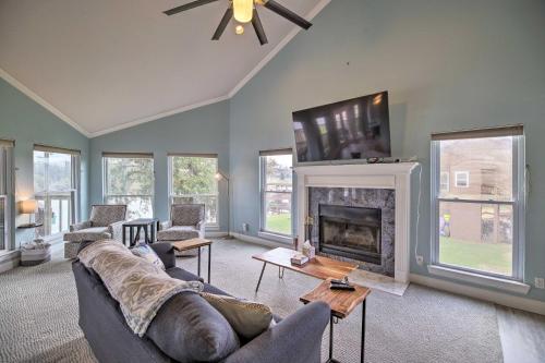 a living room with a couch and a fireplace at Waterfront San Jacinto River Home with Boat Slip! in Houston