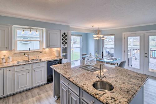 a kitchen with a sink and a counter top at Waterfront San Jacinto River Home with Boat Slip! in Houston