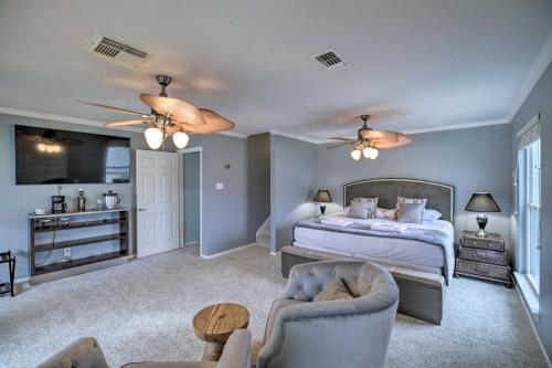 a bedroom with a bed and a living room at Waterfront San Jacinto River Home with Boat Slip! in Houston
