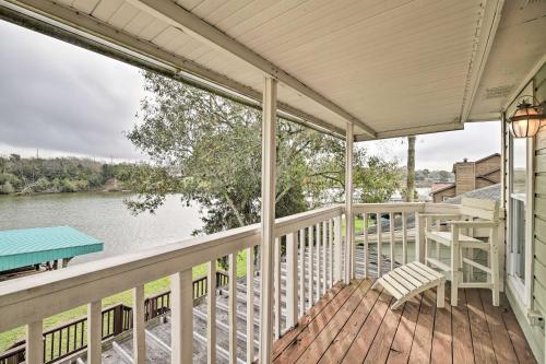 a porch of a house with a view of the water at Waterfront San Jacinto River Home with Boat Slip! in Houston