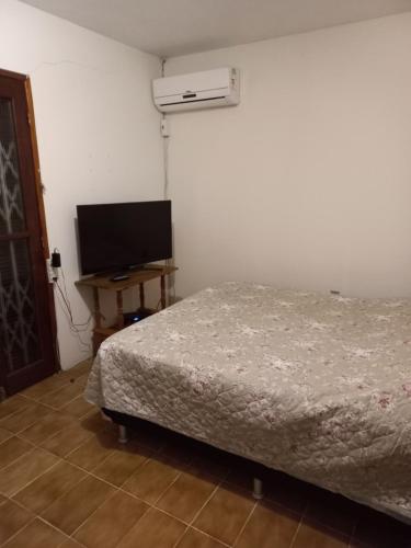 Una cama o camas en una habitación de Casa de Praia na Praia dos Ingleses