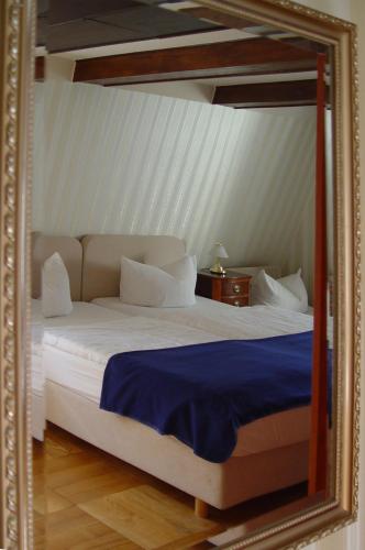 Ένα ή περισσότερα κρεβάτια σε δωμάτιο στο Hotel Altes Hafenhaus