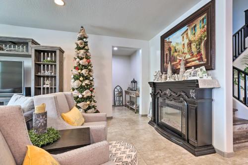 a living room with a christmas tree and a fireplace at San Tan Valley Gem with Private Pool and Hot Tub! in Queen Creek