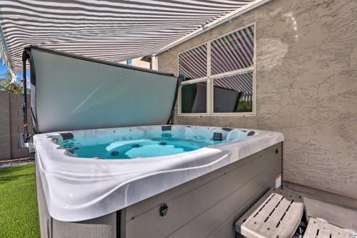 a jacuzzi tub with a bench in a backyard at San Tan Valley Gem with Private Pool and Hot Tub! in Queen Creek