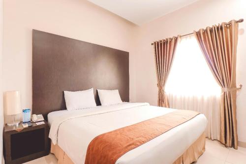 Cama o camas de una habitación en Saka Hotel Medan