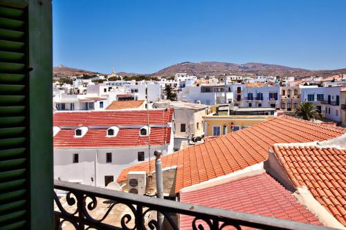 a view of a city from a balcony at Aegli 1876 in Tinos Town