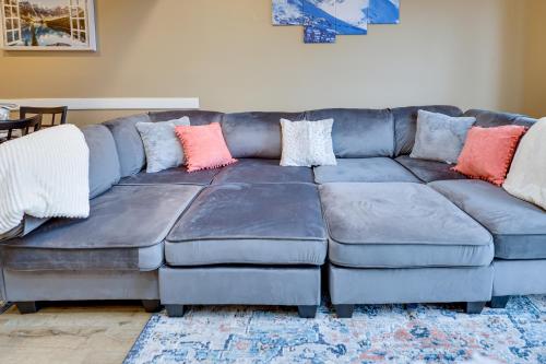 a blue couch with pillows on it in a living room at Pocono Paradise 143, NEW 4bd, Tannersville, Camelback, Kalahari in Tannersville