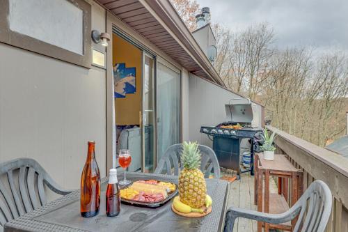 a table with a plate of fruit on a balcony at Pocono Paradise 143, NEW 4bd, Tannersville, Camelback, Kalahari in Tannersville