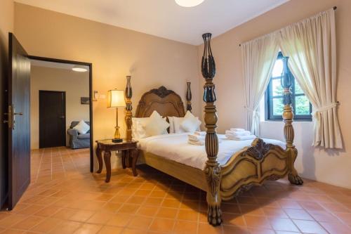 เตียงในห้องที่ Villa Malinee Khao Yai 6 Bedrooms Italian Private Villa